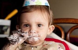 Toddler eating cake