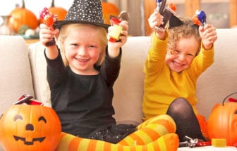 Children holding halloween candies