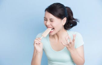 Ice cream eaten showing sensitive teeth