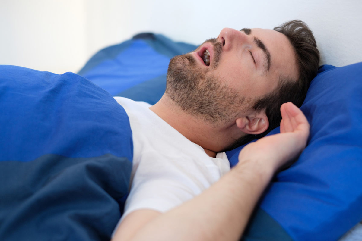 Man with sleep apnea sleeping