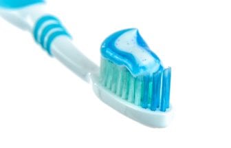 Toothbrush with toothpaste spread